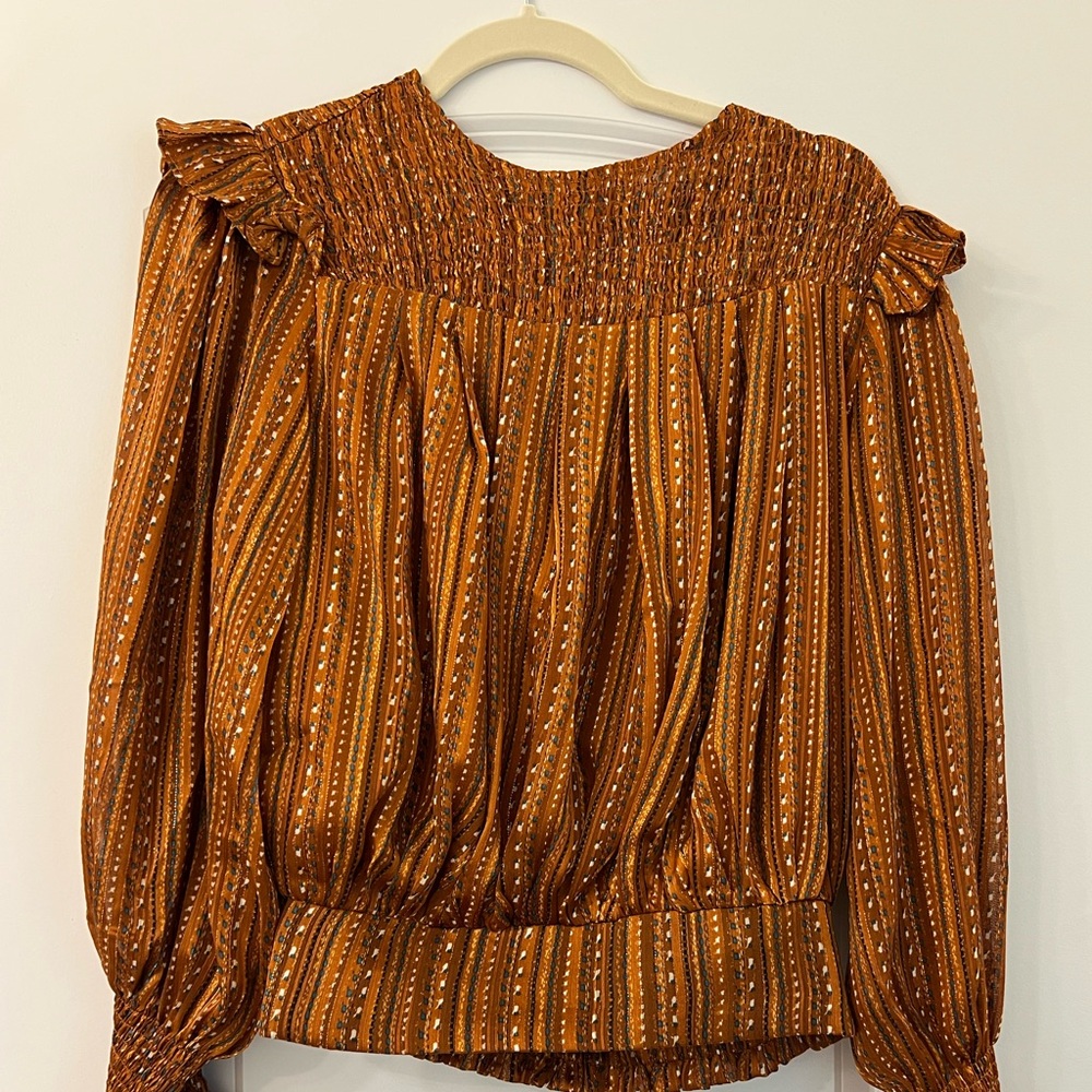 Metallic bronze dressy top. Never worn. Size small.